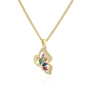 Close-up of gold butterfly pendant with colorful gemstones and crystals on fine chain