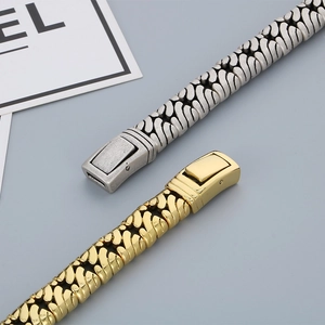 Close-up of vintage textured woven metal bracelets in gold and antique silver finishes