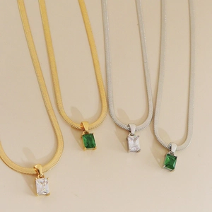 Elegant gold and silver snake chain necklaces with emerald and crystal pendants