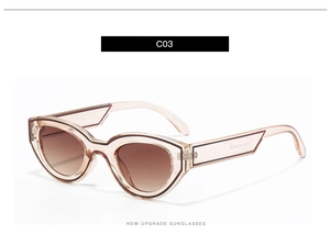 Detail view of transparent peach pink cat eye sunglasses with brown gradient lenses