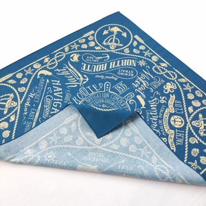 Detail of nautical marine print cotton bandana with anchor and compass patterns