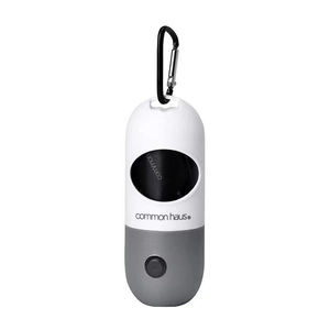 Dog poop bag dispenser capsule in white and grey with black metal carabiner hook