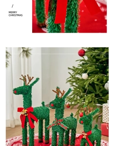 Detailed view of three green reindeer ornaments with red bows and pine needle texture