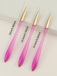 Detailed view of three gradient pink nail liners with different lengths and golden ferrules