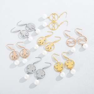 Variety of pearl drop earrings with angel and infinity motifs in gold and silver finishes