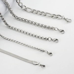 Detailed macro view of five distinct stainless steel link styles and lobster claw clasps