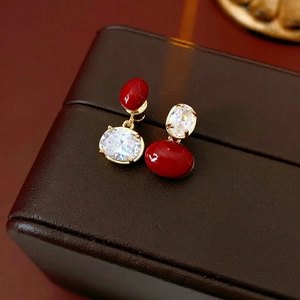 Vintage style asymmetric gold earrings with red oval glaze and clear zircon stones