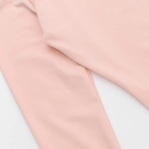 Close-up of pink square neck top showing high-density knitted fabric texture and soft finish