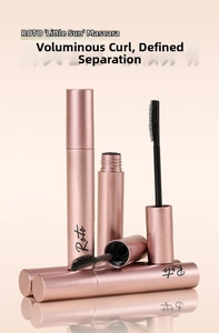 Close-up of rose gold mascara tubes with spiral brush for long-lasting lash curling