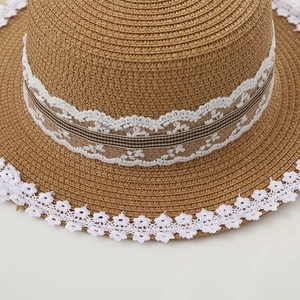 Summer straw hat with white lace trim and bow, wide brim sun protection for women