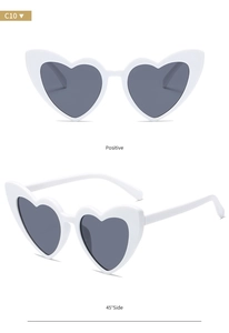 Front and 45-degree angle views of white heart-shaped sunglasses with grey lenses