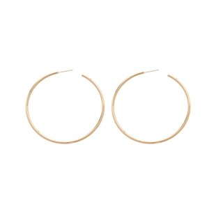 Minimalist polished golden hoop earrings set in a symmetrical layout on white background