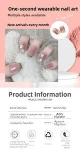 Detail view of pink and green floral short press-on nails with product specifications table