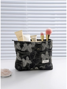 Elegant black butterfly jacquard cosmetic bag with high capacity and interior storage
