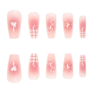 Pink ombre press-on nails with heart patterns and gold metallic line designs