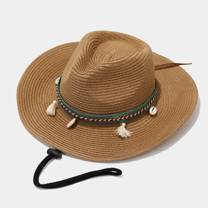 Bohemian khaki straw sun hat with shell pendant and tassel detail for beach vacations