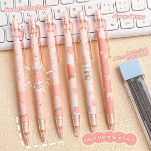 Set of 6 cute pink peach mechanical pencils with 0.5mm leads on a minimalist desk setup