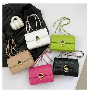 Detailed arrangement of quilted crossbody bags in white, green, beige, rose and black colors