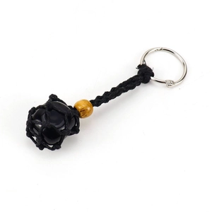 Detailed macro view of a natural tiger stone in a black mesh cord adjustable keychain