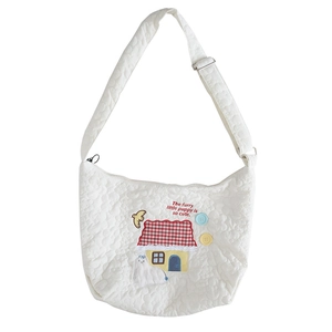 Quilted white cotton tote bag featuring embroidery of dog and house with adjustable strap