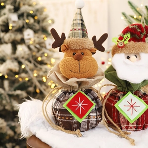Plaid Christmas gift drawstring bags with Santa Claus and reindeer on white faux fur