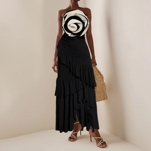 Elegant black and white contrast one-piece swimsuit with oversized 3D floral accents