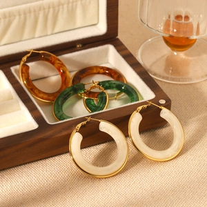 French vintage resin hoop earrings in cream, emerald, and amber tones with gold accents