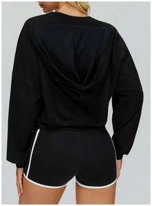 Rear view of black hooded sweatshirt and sports shorts with white contrast side stripes