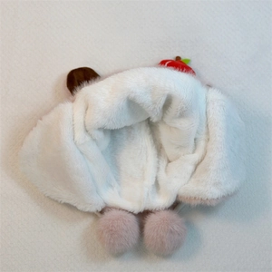 Close-up of thick plush fleece lining on pink Capybara earflap hat for winter