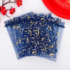 Dark blue organza jewelry pouches with gold star and moon patterns for gift storage
