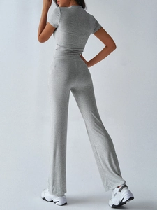 Back view of a grey casual two-piece lounge set with short sleeve top and long trousers