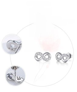 Macro shot of S925 sterling silver infinity earrings with handset cubic zirconia pave