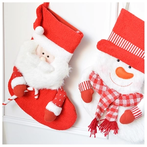 Detail of plush 3D Santa and snowman knit Christmas stockings with soft textures