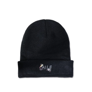 Detail of black knit beanie with colorful SMILE embroidery and rainbow star patterns