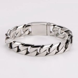Close-up of a silver chunky stainless steel cuban link bracelet for men in hip hop style