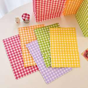 Detailed close-up of colorful checkered gift paper bags in various vibrant shades