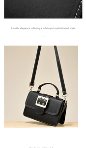 Detail of black litchi leather bag with gold buckle and white contrast stitching