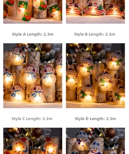 Détail de guirlandes lumineuses LED de 2,3m avec bonhommes de neige et chaussettes de Noël