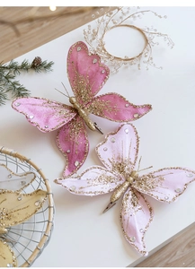 Close-up of pink sequined fabric butterfly clip with glitter and rhinestones for Christmas
