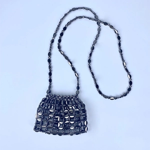 Detailed view of gunmetal sequin mesh mini crossbody bag with matching chain strap