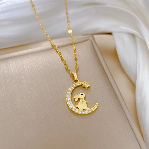 Luxurious gold moon and bunny pendant necklace with sparkling cubic zirconia accents