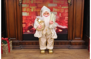 Close-up of a 24-inch standing Santa Claus figurine in gold and white holiday attire