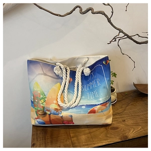 Detail of oil painting style canvas tote with beach motifs and thick hemp rope handle