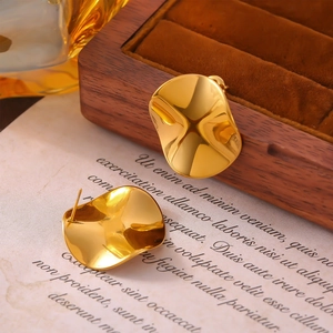 Golden irregular pleated geometric stud earrings with high-shine metallic texture finish