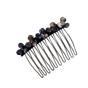 Elegant metal hair comb with dark marble texture flower for stylish bun hairstyles