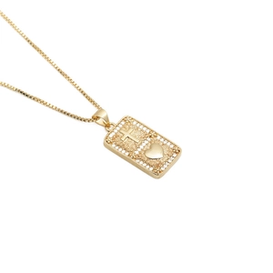 Gold rectangular pendant necklace with embossed cross, heart and crystals on box chain