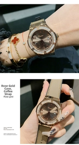 Detail of rose gold quartz watch with brown sunray dial and rhinestone bezel on wrist