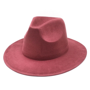 Close-up of deep burgundy fedora hat with wide brim and stitched felt edge detailing