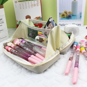 Detail of a large-capacity cream canvas stationery bag showing interior storage space