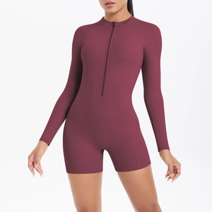 Front view of a wine red long sleeve sports bodysuit with half-zip and high neckline